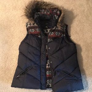 Puffer vest with a fur hood